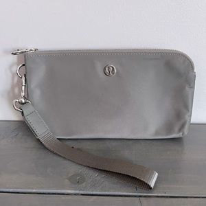 Lululemon curved wristlet, grey sage colour.